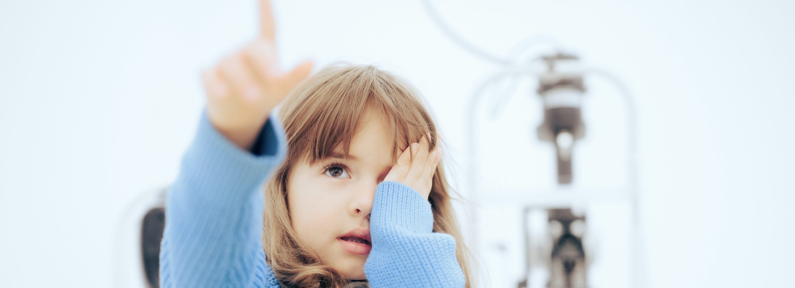 girl having an eye exam myopia management