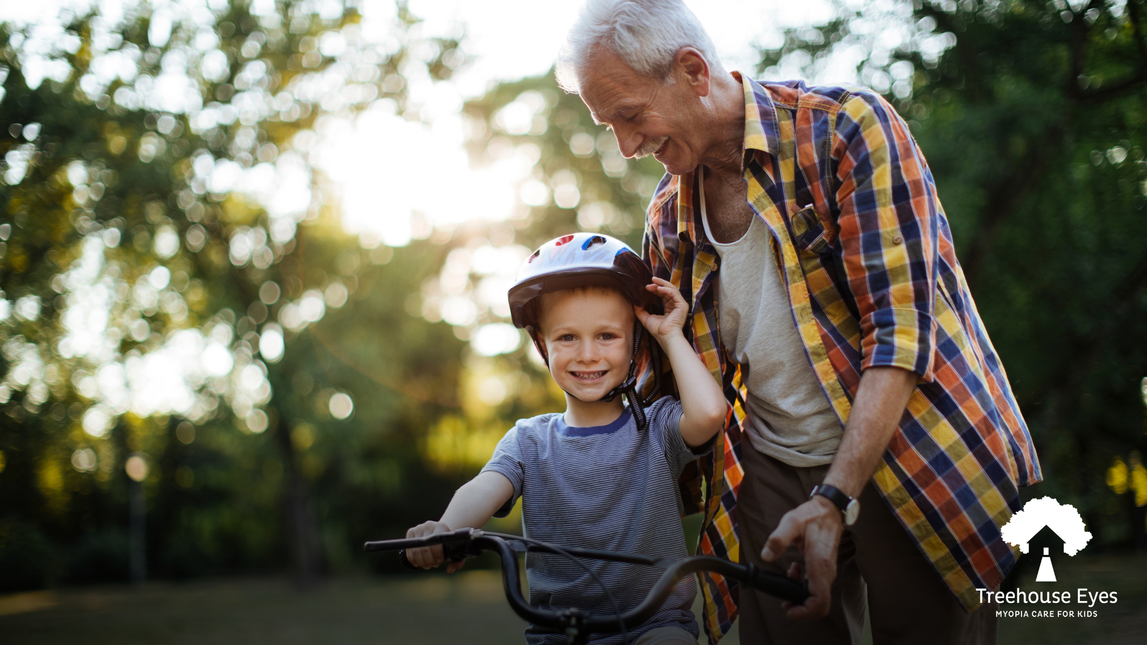 Kid riding bike with grandfather