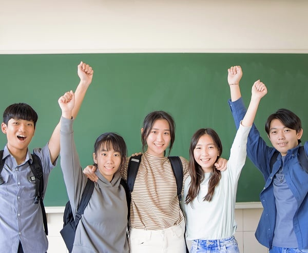 Myopia treatment results at Treehouse Eyes in Winfield IL. School students celebrating together myopia treatment.