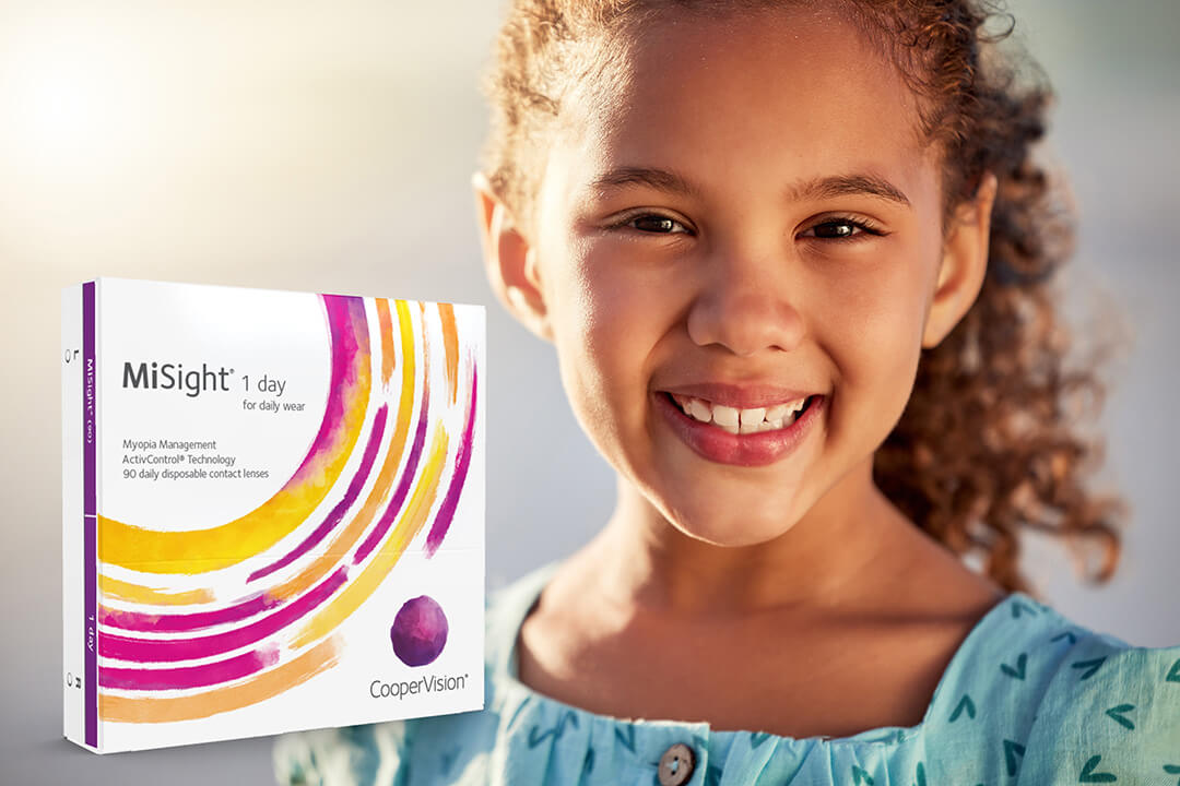 A happy child enjoying clear vision outdoors after receiving MiSight myopia treatment in Greensboro, NC.