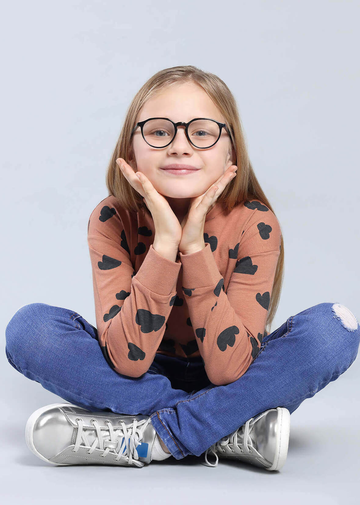 A pediatric eye doctor at our Los Angeles, CA clinic discussing myopia treatment options with a young patient.