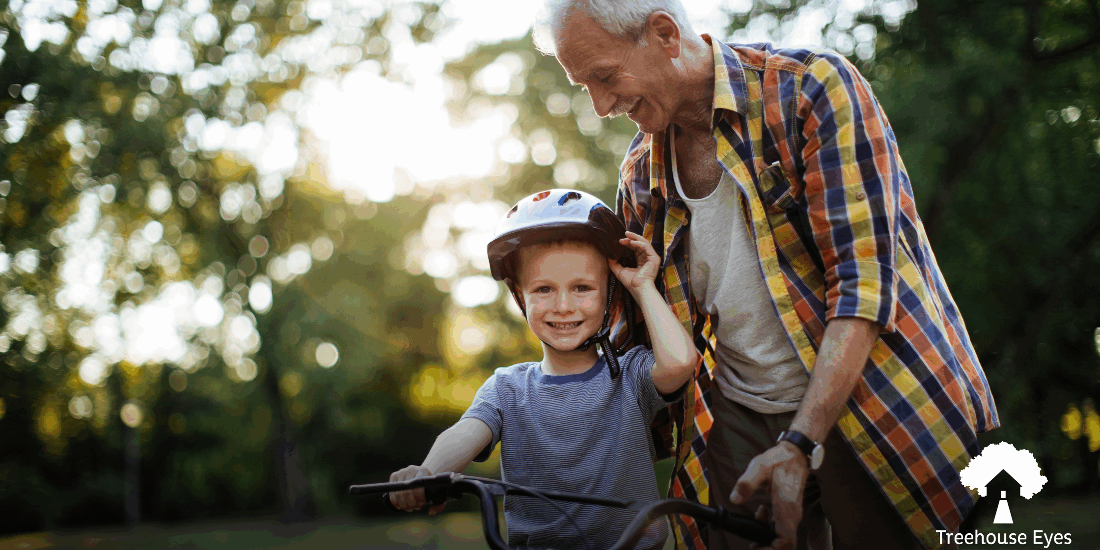 Kid riding bike with grandfather
